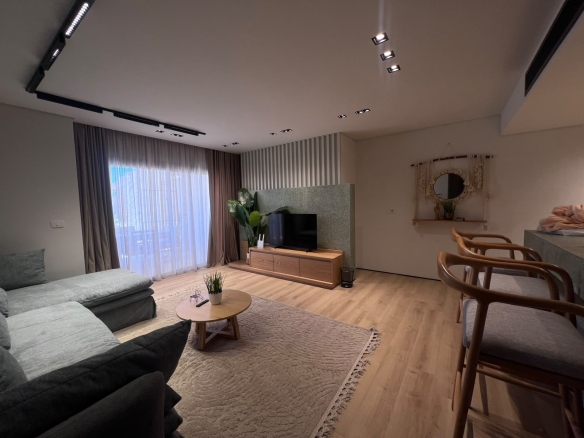 Living room with track lighting and striped curtains in Mesca cabana, Soma Bay